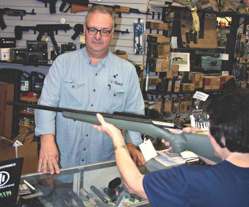 Customer trying rifle fit