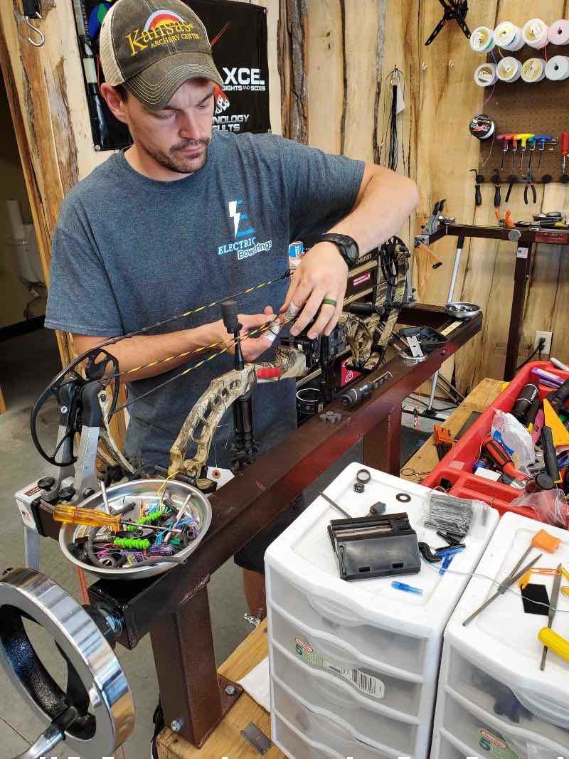 Resize SGS95 Kansas Archery Center employees working on customer bows copyright Kansas Archery Center