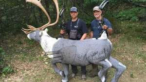 Bowhunters near 3 D caribou target