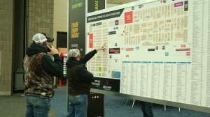 Guys looking at ATA Show floor map