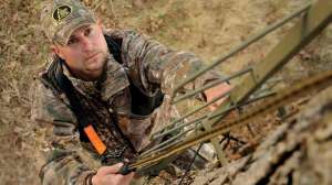 Hunter climbing treestand