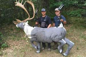 Bowhunters near 3 D caribou target