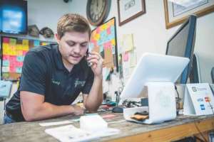 Shop owner on phone