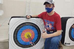 Masked kid with target