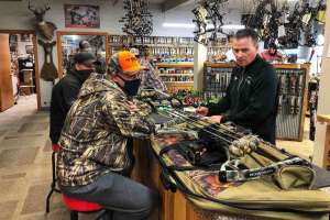 Resize SGS102 Al Kraus Black Hills Archery helps customers with bow repairs in his full service pro shop copyright Mark Kayser 2